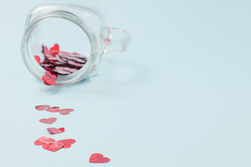 Numerous red hearts with glass bottles with blue backgrounds