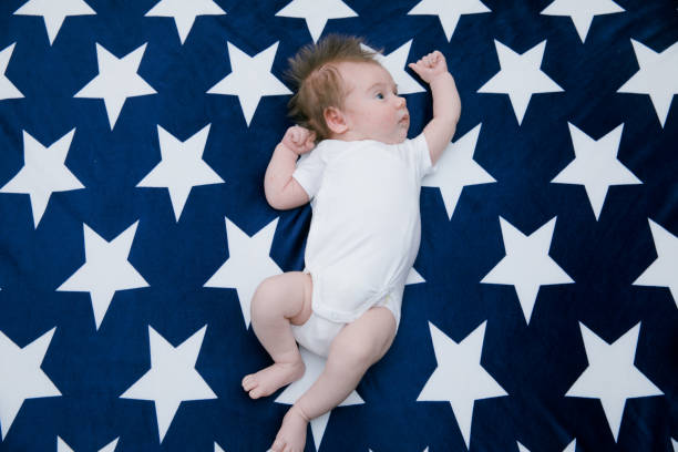 istock Small cute funny baby infant teething with face expression 1256704602