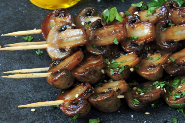istock Skewers with mushrooms. Balsamic grilled mushroom. 1256705849