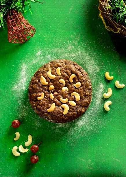 Christmas Fruit cake on rustic green background ,Top down view