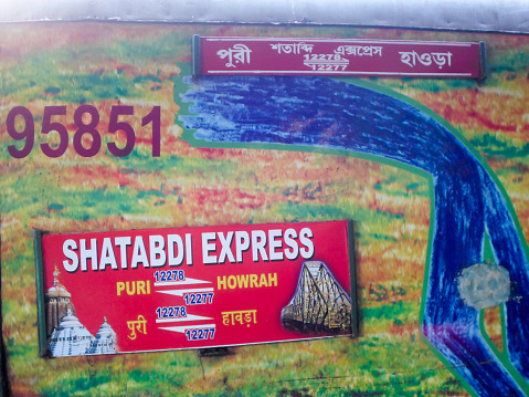 Nameplate on the Coach of Puri Howrah Shatabdi Express of East Coast Indian Railway zone. Its a long distance destination trains coaches of Duronto Express have very unique characteristic of yellow-green livery. These trains run faster than Rajdhani Express with feature exclusive to Duronto LHB Sleeper coach. Howrah India May 2019