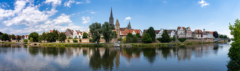A panorama view of the city of Ulm in southern Germany with the Danube River in front