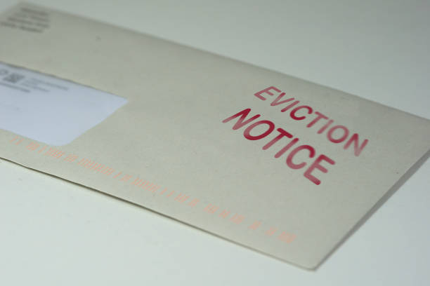 Envelop for an eviction notice to a defaulting renter in due to missed rent in recession Envelop for an eviction notice to a defaulting renter in due to missed rent in recession information sign stock pictures, royalty-free photos & images