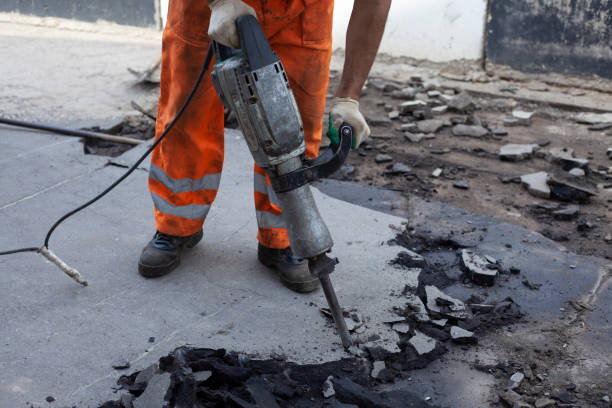 istock Road repair. Workers are laying asphalt. 1256713888