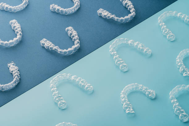 Transparent invisible dental aligners or braces aplicable for an orthodontic dental treatment Dental aesthetic ortodontics brushing photos stock pictures, royalty-free photos & images