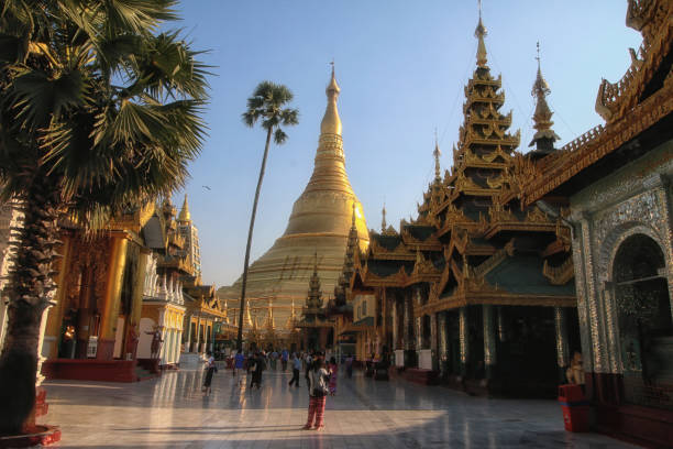 Golden Stupa of Shwedagon Pagoda at sunny day in Yangon, Myanmar. Shwedagon Pagoda is the most popular and well-known pagoda in Yangon.