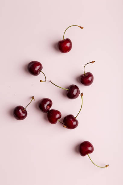 istock sweet cherry at minimal pink background 1256719150