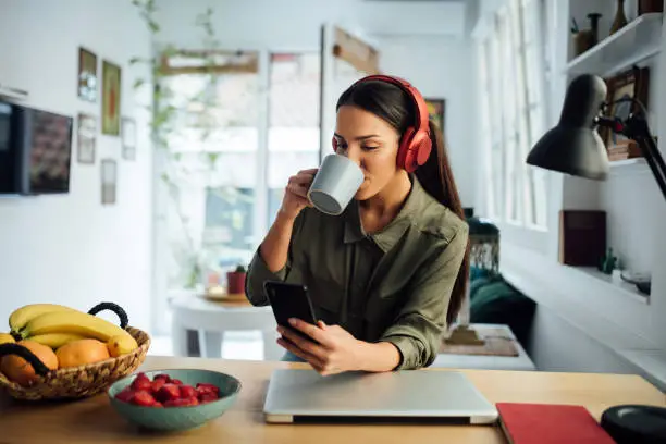 Photo of Happy young businesswoman working at home