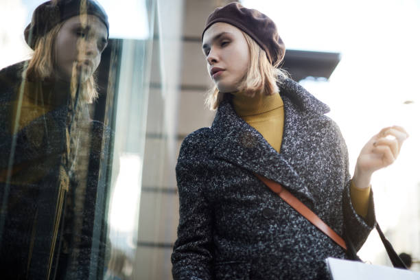 istock Transgender man window-shopping in Barcelona. 1256721066