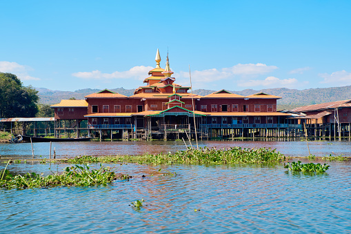 Wooden floating houses on Inle Lake in Shan, Myanmar, view from boat