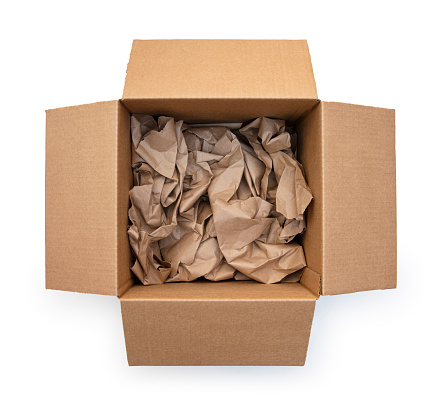 This is an overhead photograph of an open brown cardboard shipping box with crumpled brown paper inside isolated on a white background. This photo will allow you to drp your own product inside the box