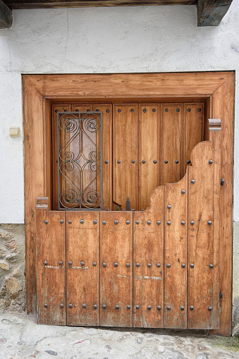 Typical wooden door with two parts, in Candelario, Salamanca, Castilla Leon, Spain, Europe. Traditional town.