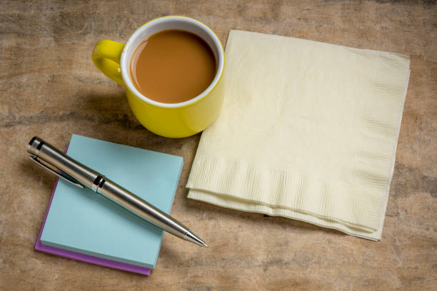reminder note and napkin abstract, office or coffee break concept