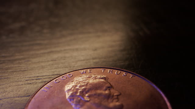 Extreme Close-Up Macro Moving Slider Shot of the Top Heads Side of an American Currency Penny Worth One Cent