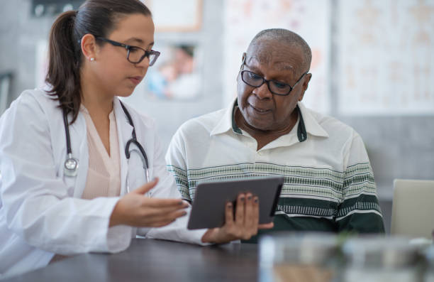 istock Man seeing his medical test results on tablet 1256731535
