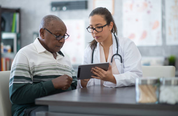 istock Man seeing his medical test results on tablet 1256731537