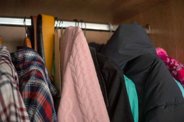 istock Open wardrobe with clothes close up 1256732198