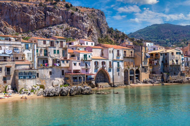 istock Sandy beach in Cefalu in Sicily 1256733293