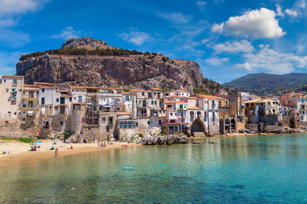 istock Sandy beach in Cefalu in Sicily 1256733372