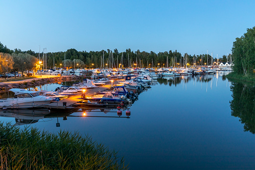 Espoo, Finland - jun 16th 2020: Recreational boats are docked in Haukilahti small boat harbor. Local yacht club is organising volunteer security patrols to ensure the safety of boats.