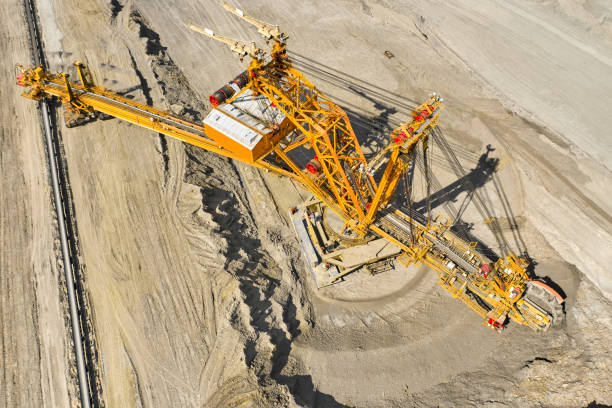 istock Top view of a bucket wheel excavator mining coal in an open pit mine. 1256733892
