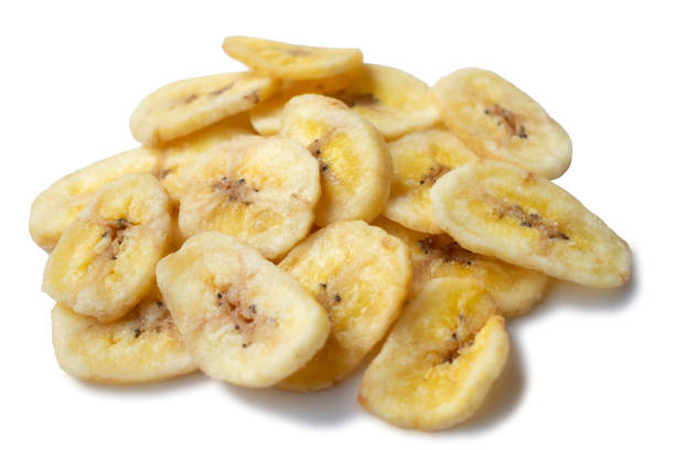 istock A pile of banana chips on white background, isolated 1256734921
