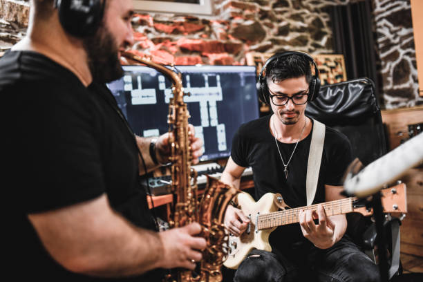 istock Sax And Guitar Recording In Professional Music Studio 1256735054