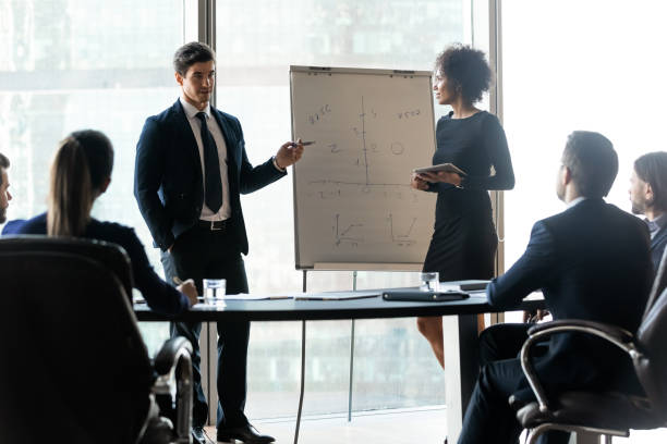 istock Two confident mixed race speakers giving lecture to colleagues. 1256739943