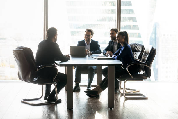 istock Happy diverse colleagues hr team holding job interview with candidate. 1256739961