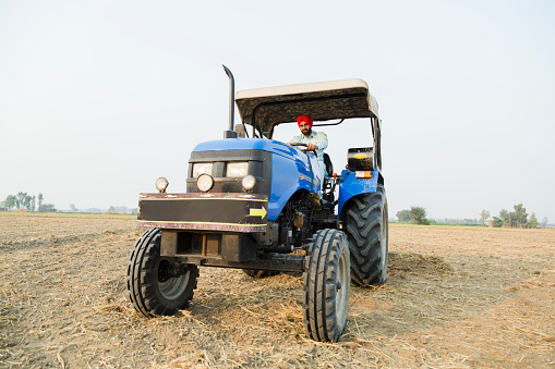 Fort Meade, FL - February 22, 2022: Low perspective side view of a 1957 Case 400 High Crop Tractor at a local car show.