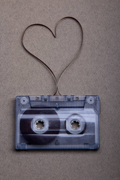 istock Cassette tape with a heart symbol on grey background 1256743863