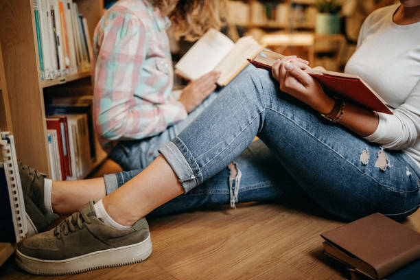 istock Girls reading together 1256746447
