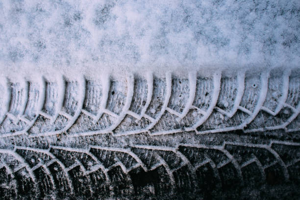 istock trace of the tread on snow machines 1256751880