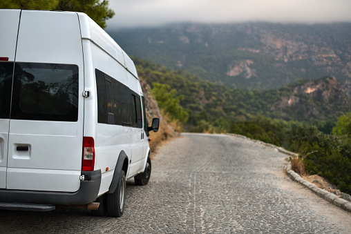 Tourist minibus on mountains road