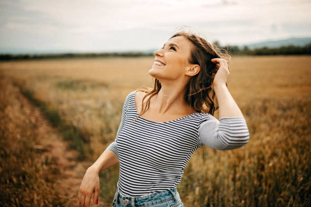 Young women enjoying summer in meadow