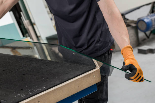 istock Glass factory, Glazier lifting that table glass 1256756442