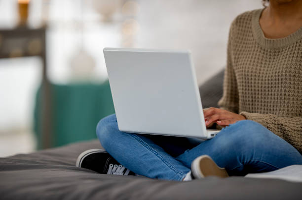 istock Teenage girl does school work from home 1256756631