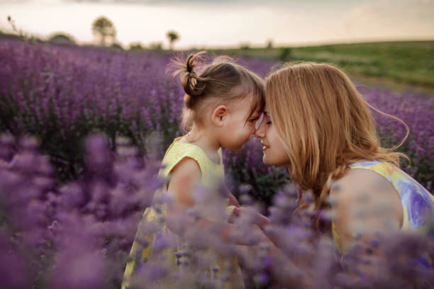 istock Mother with daughter in a lavender field 1256756679