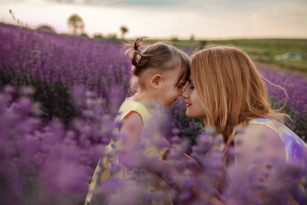 istock Mother with daughter in a lavender field 1256757268