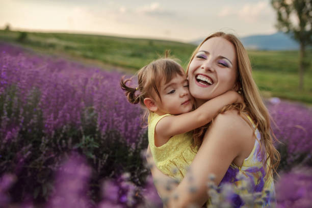 istock Mother with daughter in a lavender field 1256757290