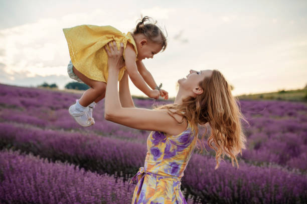 istock Mother with daughter in a lavender field 1256757329