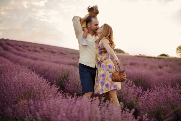istock Young family in a lavender field 1256757351