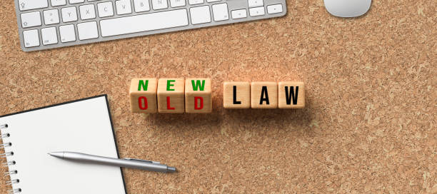 cubes with words OLD LAW and NEW LAW
