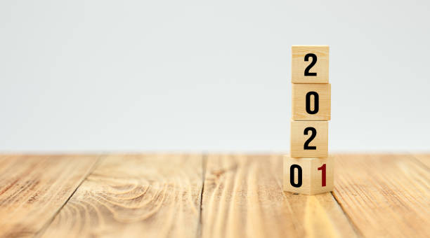 istock cubes turning from year 2020 to 2021 - 3d illustration 1256759911