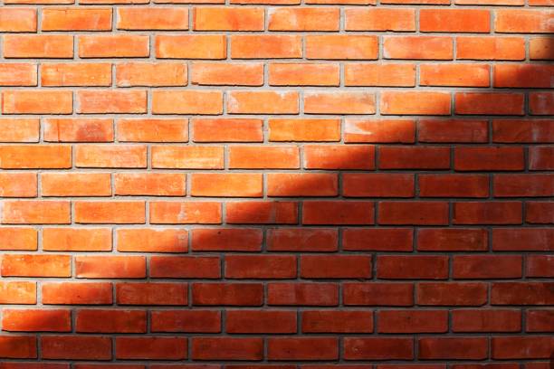istock Light and shadow, textures on the wall is made of clay bricks 1256767233