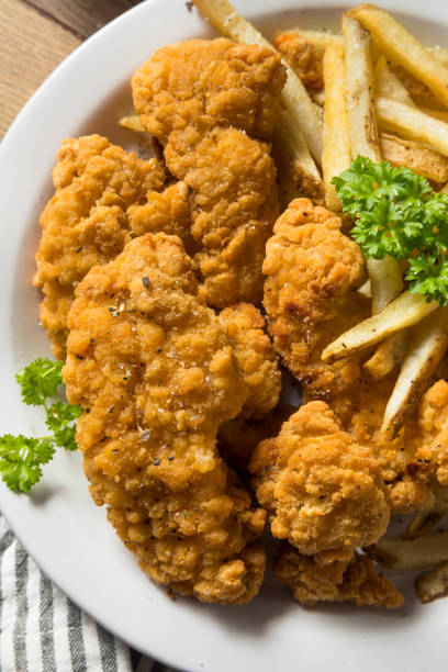 istock Deep Fried Chicken Tenders and Fries 1256767374