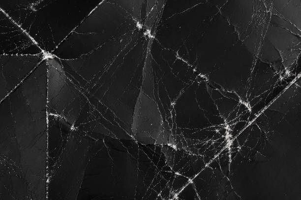 istock Damaged black folded dark paper with wrinkles and defects 1256768795