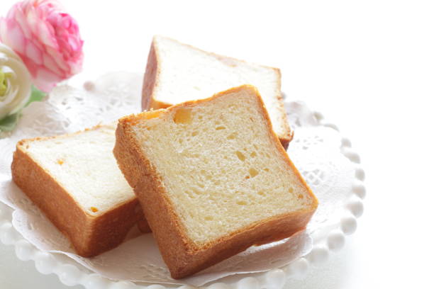 istock dried ornage bread, sliced on wooden board 1256768843