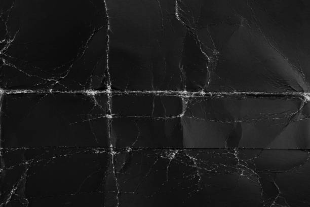istock Black old paper with folds and roughness 1256769084