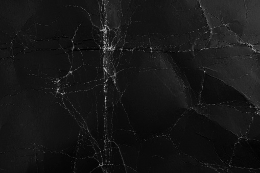Abstract rough black background. Old packing grungy dark cardboard material. For web page design.